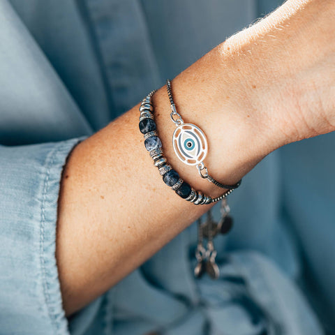 Woman's wrist with Air and Anchor Bracelets on it