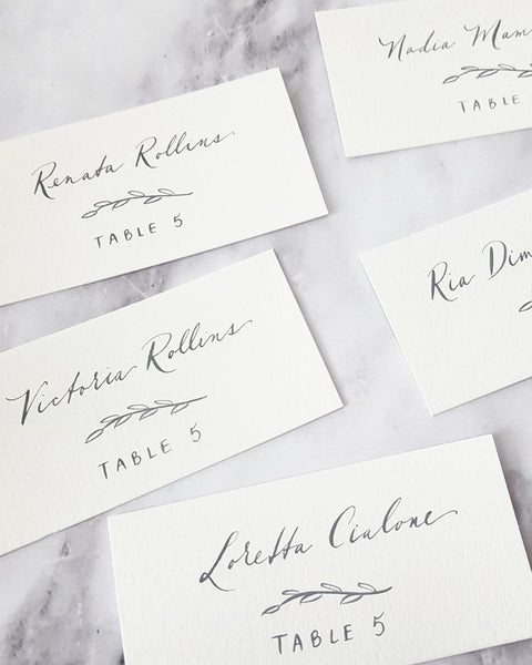 Grey Calligraphy Escort Cards with leaf detail