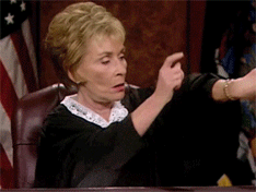 Gif of A Judge Tapping Her Clock On Her Wrist