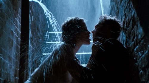 Image of man and woman making out under shower