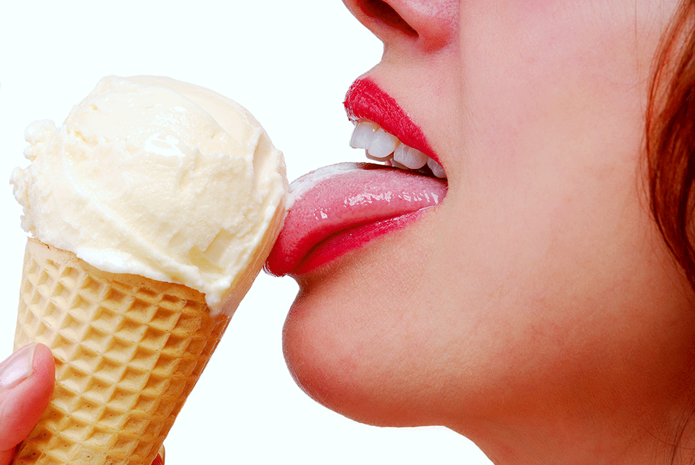 A Woman Licking The Icecream