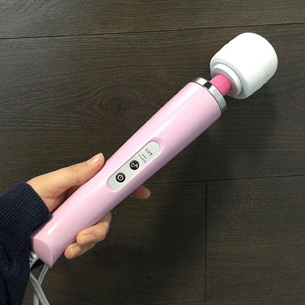 Lux Massage Wand Shown Being Held In Hand To Show Size
