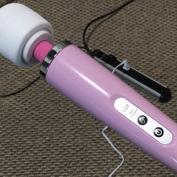 Lux Wand Shown Being Plugged Into A Power Outlet