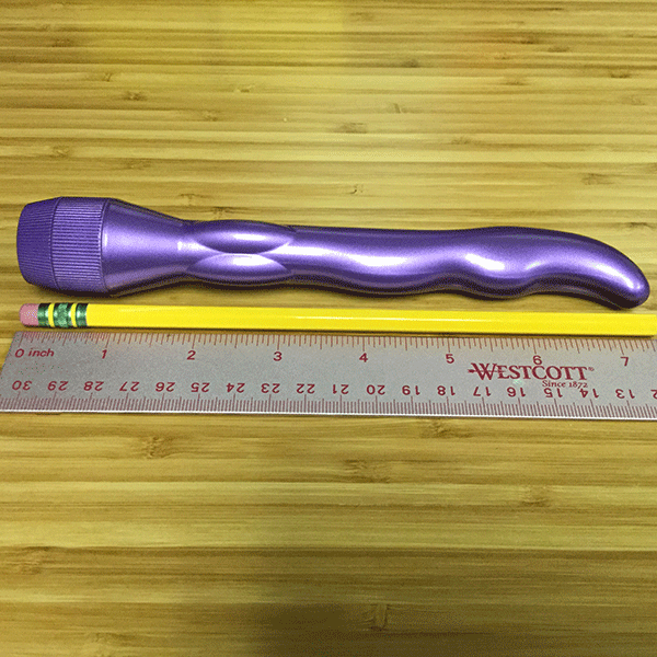 pink bob purple g-spot finder next to ruler