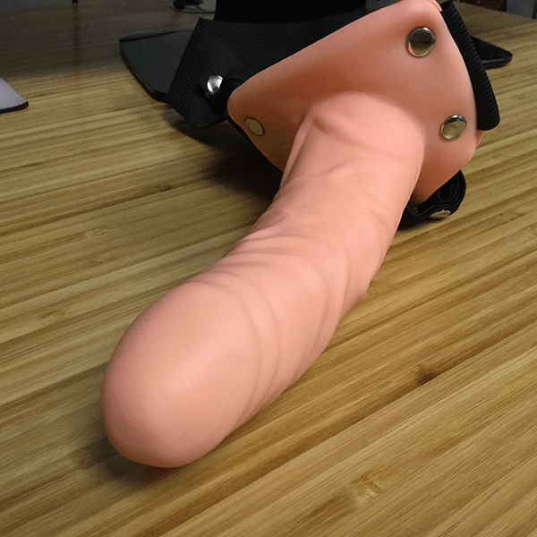 pipedream realistic strap on dildo on desk