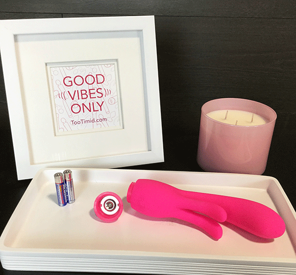 Vibrator Shown On Nightstand With Battery Compartment Opened On The Bottom