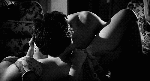 Gif video of man slowly, seductively kissing his way up his lover's body