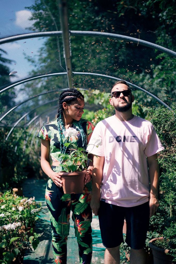 Max Wheeler and Victoria Port in a greenhouse