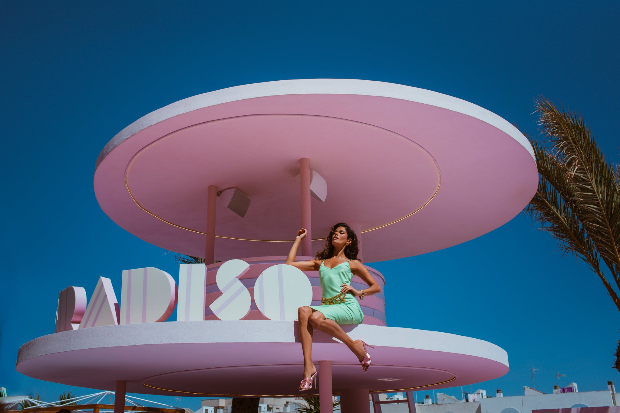 Dancing Leopard model sat on Paradiso Hotel sign