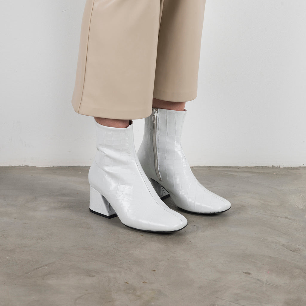 white leather heeled boots