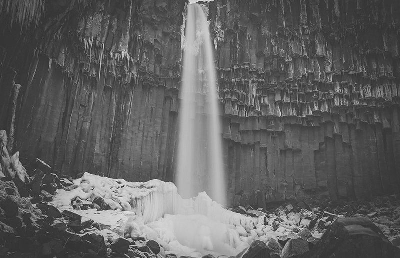 black and white photo of iceland waterfall