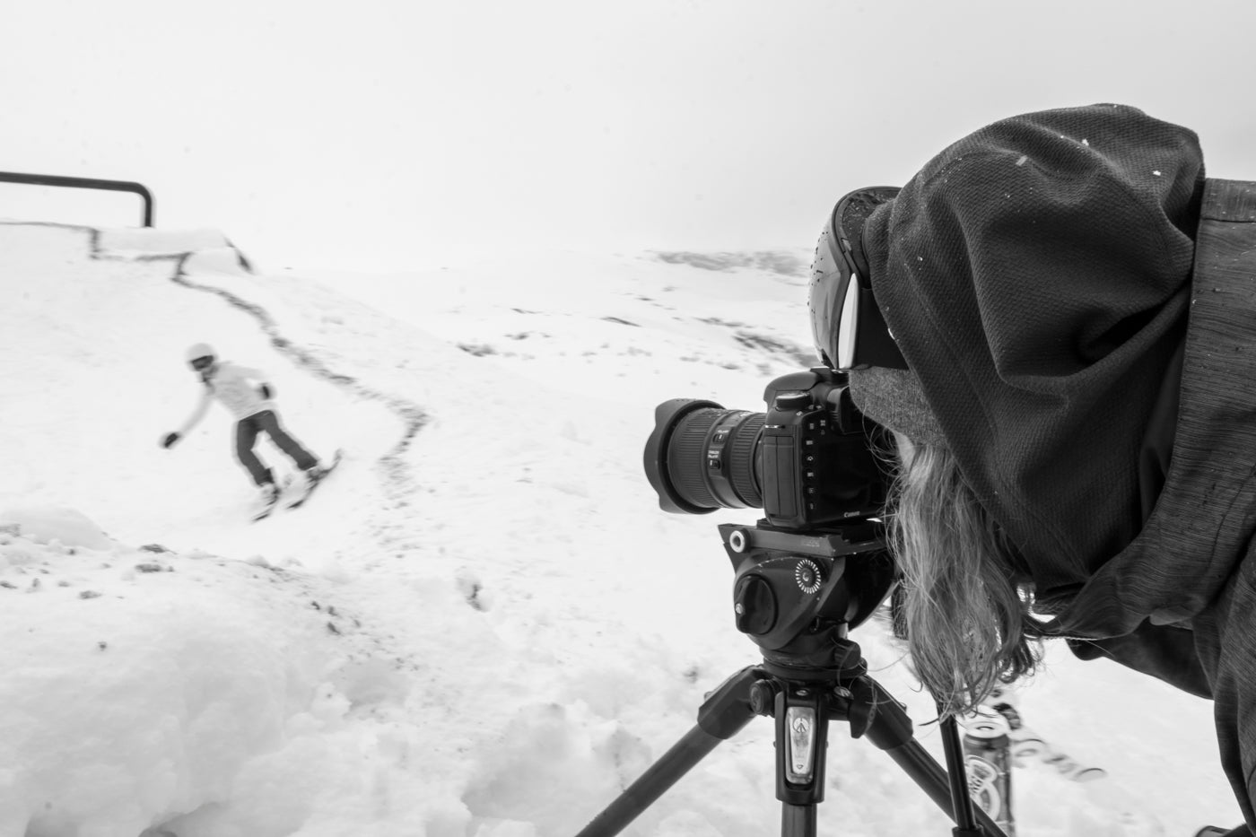 Photographer taking a photo of a skier