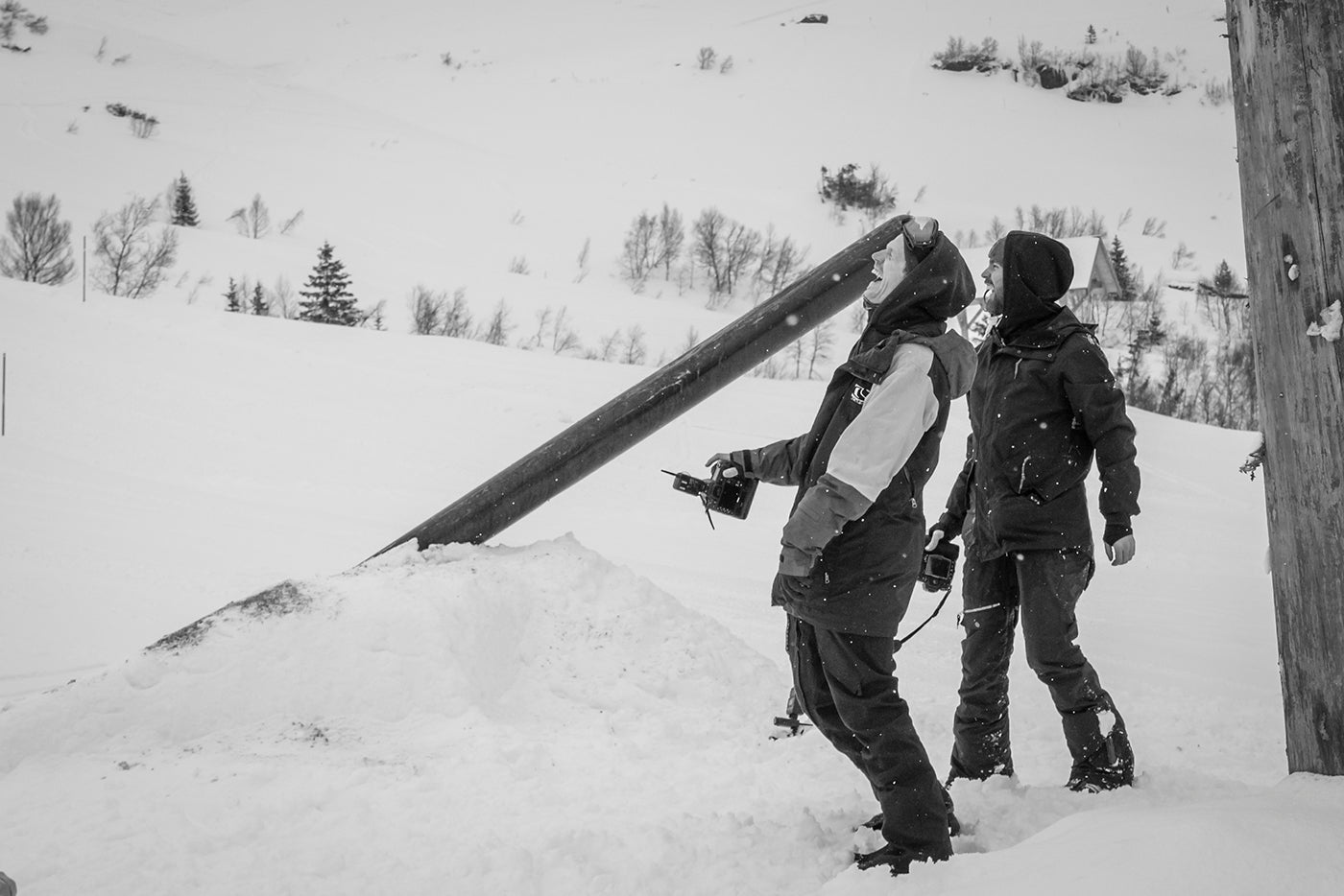 ski and snowboard photographers laughing