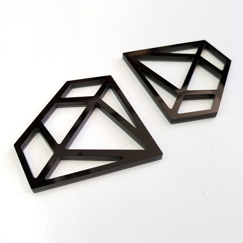 black wireframe diamond emblems