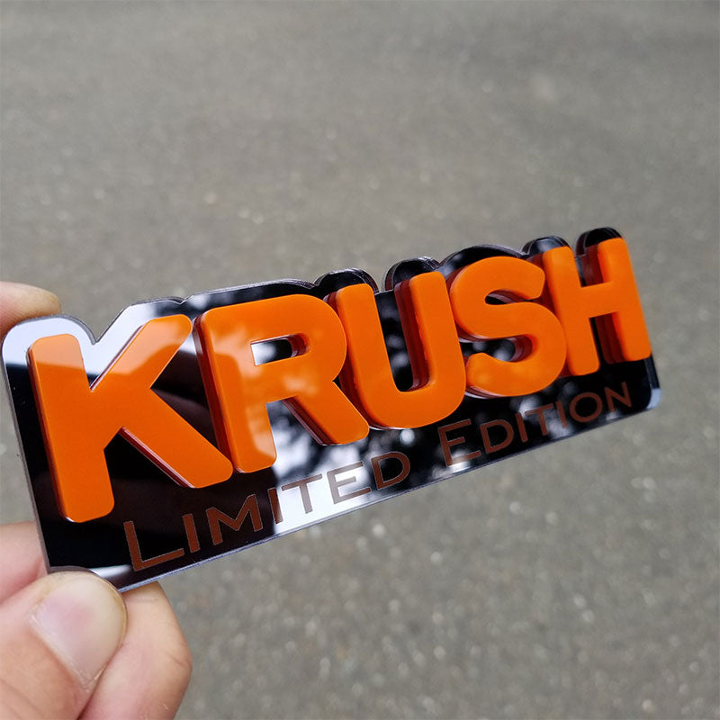 Orange and black chrome Jeep emblem