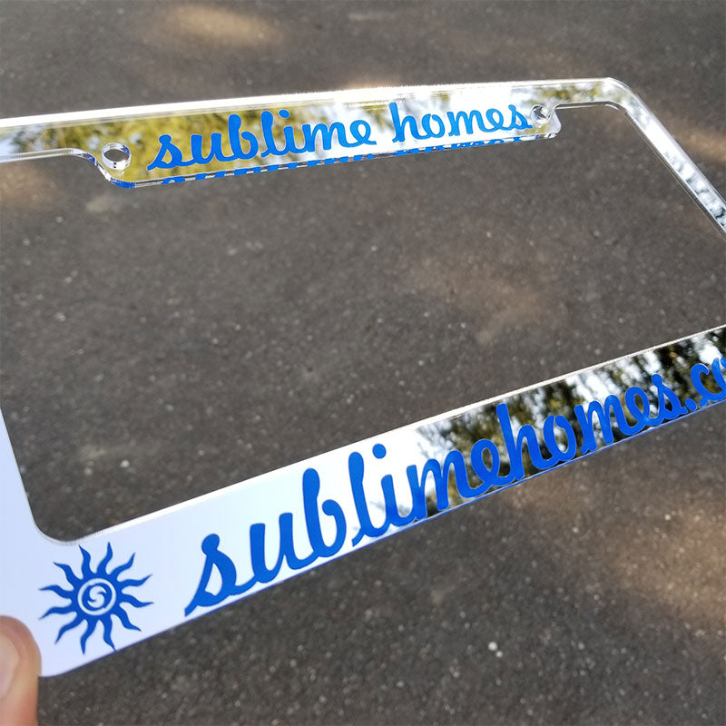 chrome and blue license plate frame