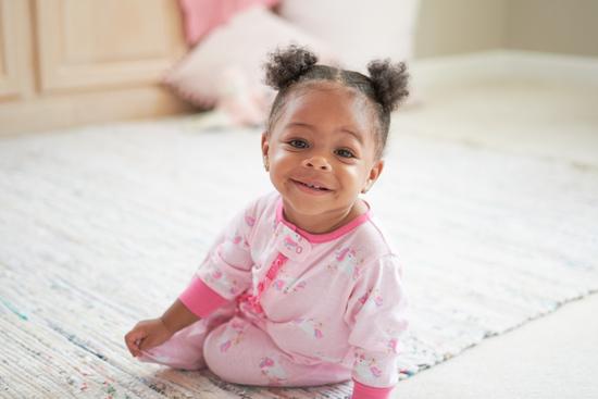 toddler in pink pajamas