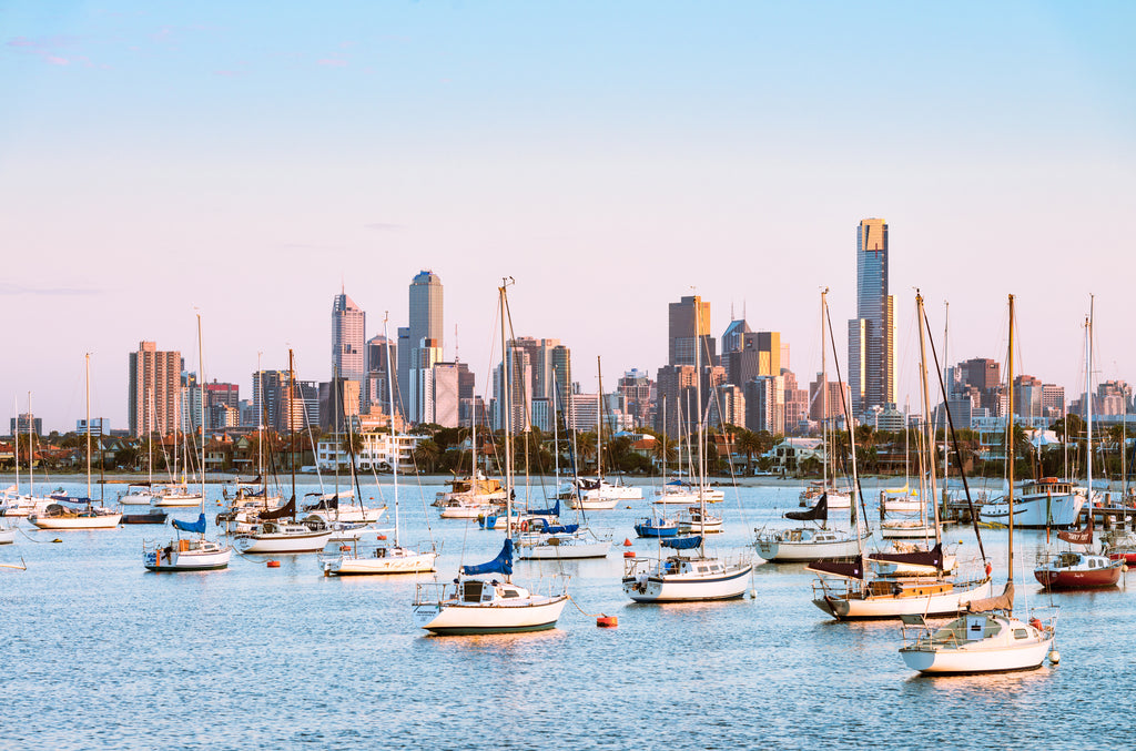 boats moored before melbourne skyline