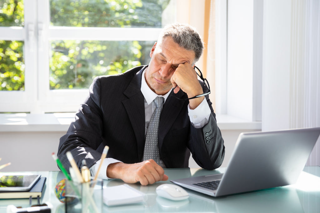 exhausted business man sleeping at desk