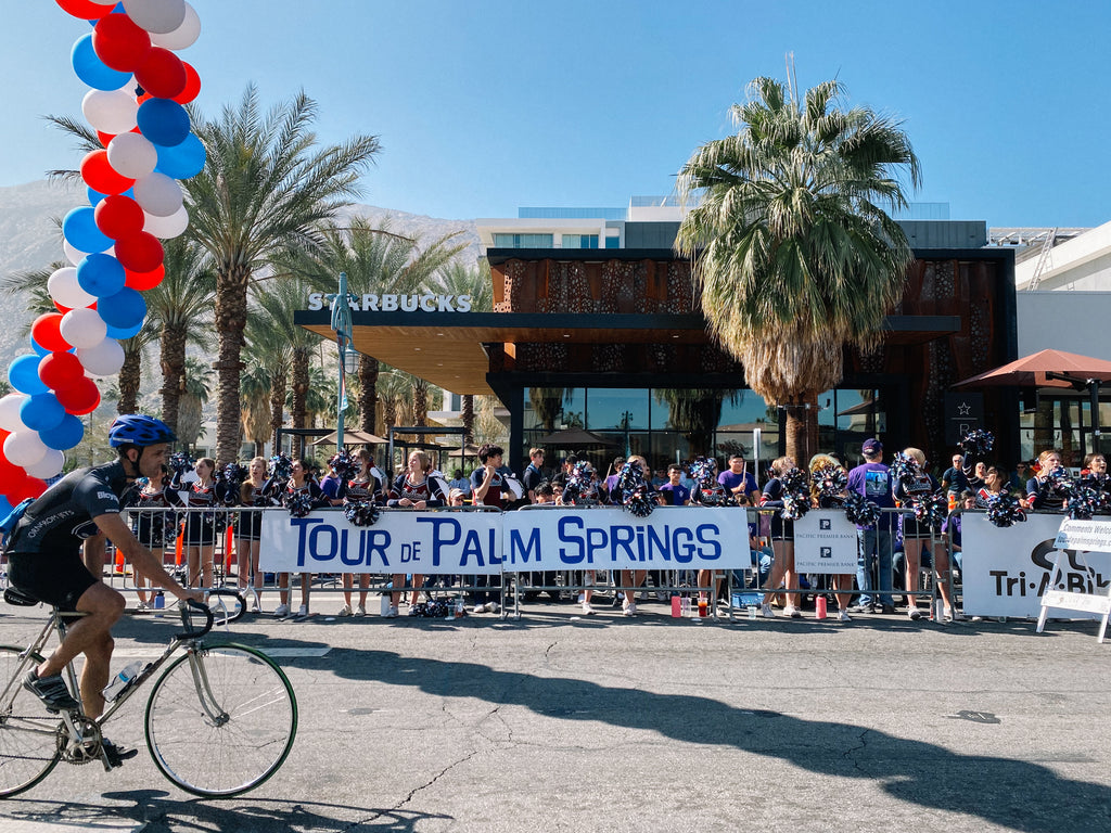 Cyclist crosses the finish line at Tour de Palm Springs.
