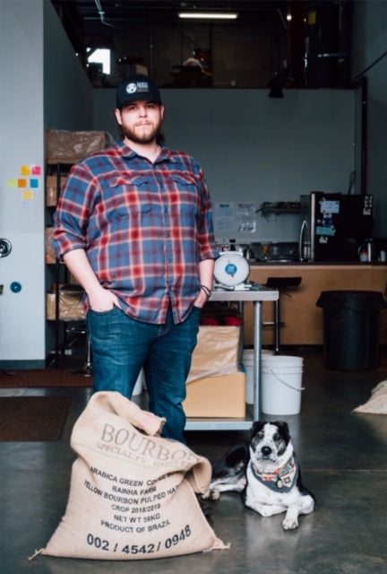 John Lynn, Head Roaster at Hugo Coffee Roasters with his rescue dog Rivers