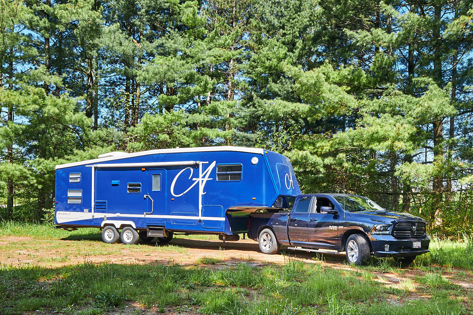 5th wheel trailer and truck blue