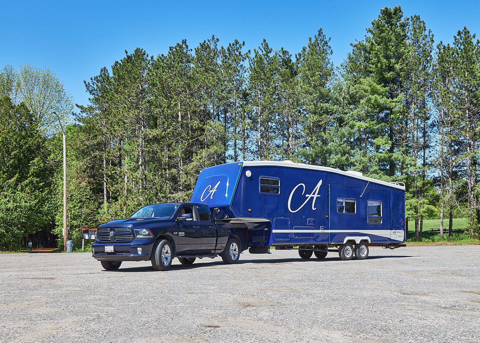 5th wheel trailer blue with truck
