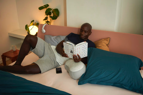 Man reads book before sleeping