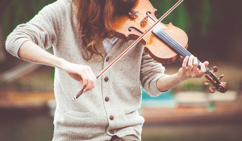 Girl practice playing violin