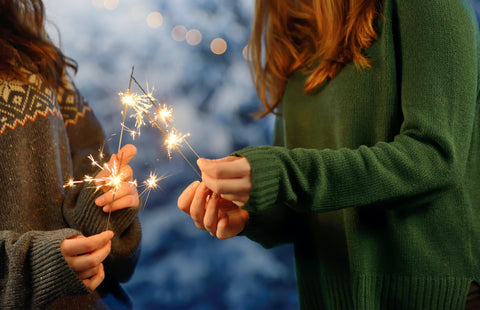Holding New Year sparklers