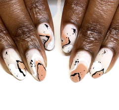 Abstract nail art with white and black details