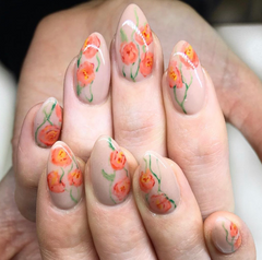 a nude nail color with orange spring time watercolor flower nail art