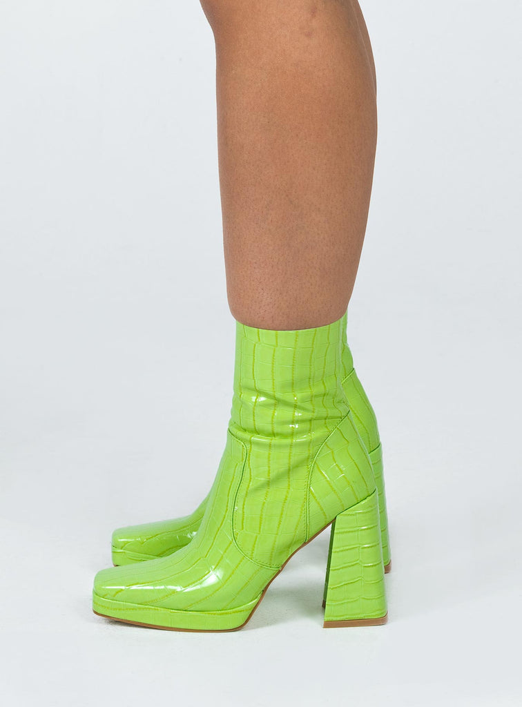 black and neon green boots