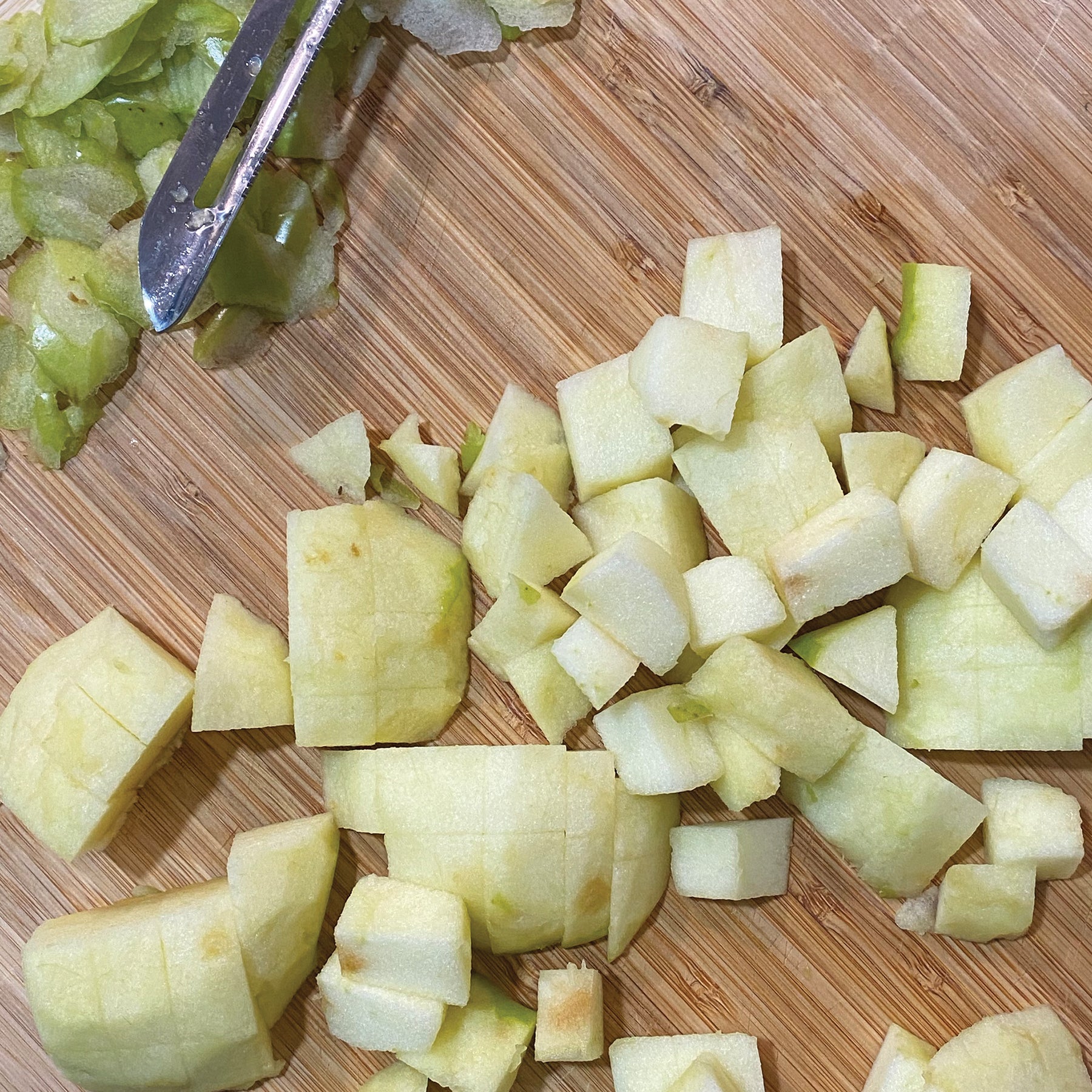Peels and cut apples on a cutting board 