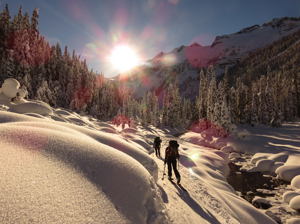 Backcountry skiing into the sun in British Columbia