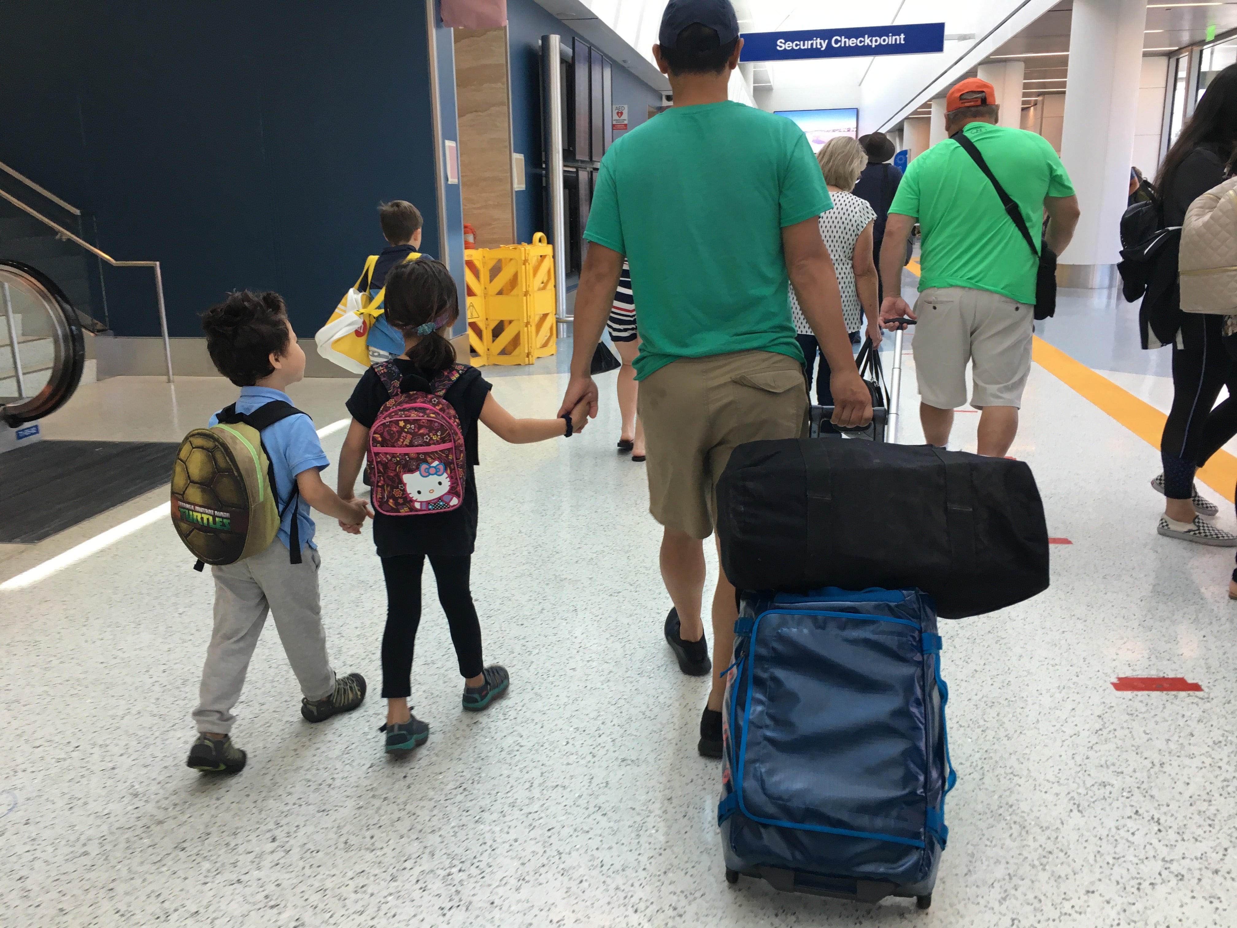 The kids help carry their own bags!