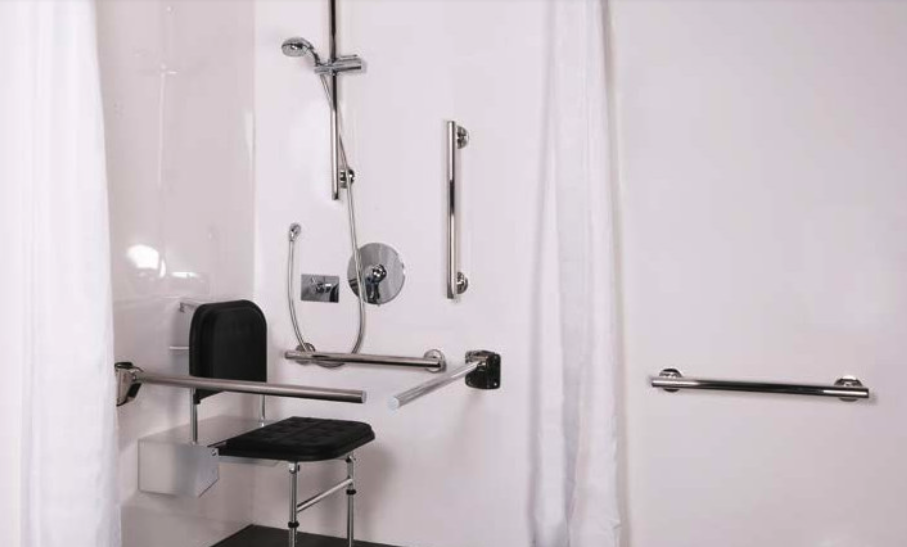 A shower with grab rails and other mobility aids that helping in a bathroom