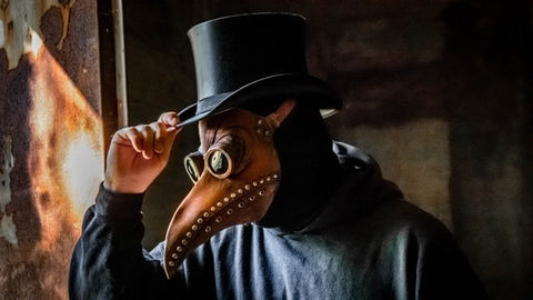 A man wearing a mask that looks like a beak
