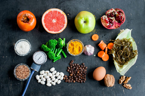 the image shows a selection of healthy food with a blood pressure monitor