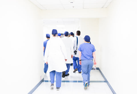 the image shows a group of medical professionals working together