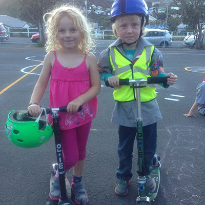 Kids learning scooter safety on their Micro Scooters 