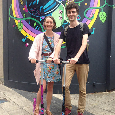 Couple scooting the commute together 