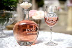 JNSQ Rosé Cru bottle with a rose wine glass