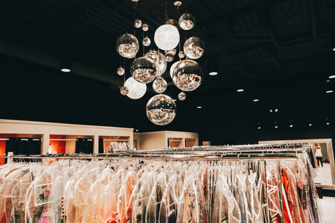 Above view of XO's dress racks. You can see the multi disco ball chandelier at the top of the image.