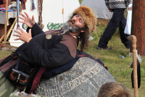 Storyteller on a runestone at Lofotr Viking Festival - Viking Dragon Blogs
