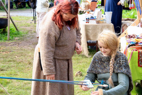 Tablet weaving lessons at Lofotr Viking Festival