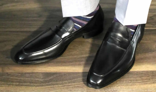 Black penny loafers with socks