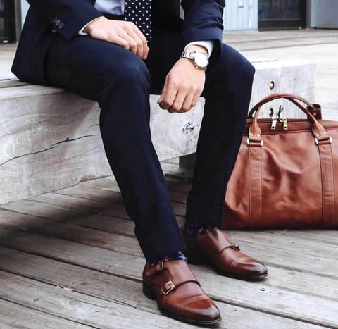 Tan monks with navy blue suit