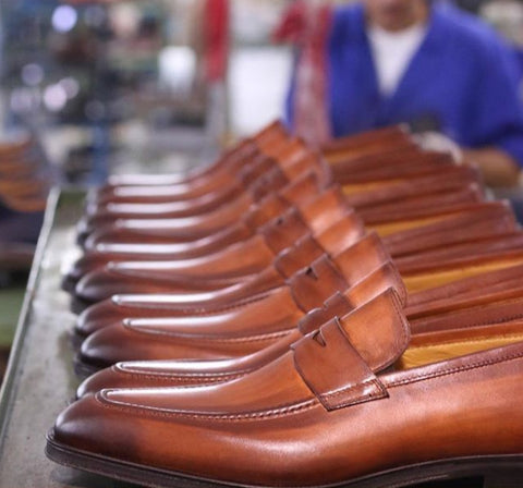 Penny loafers being made in a factory in Italy