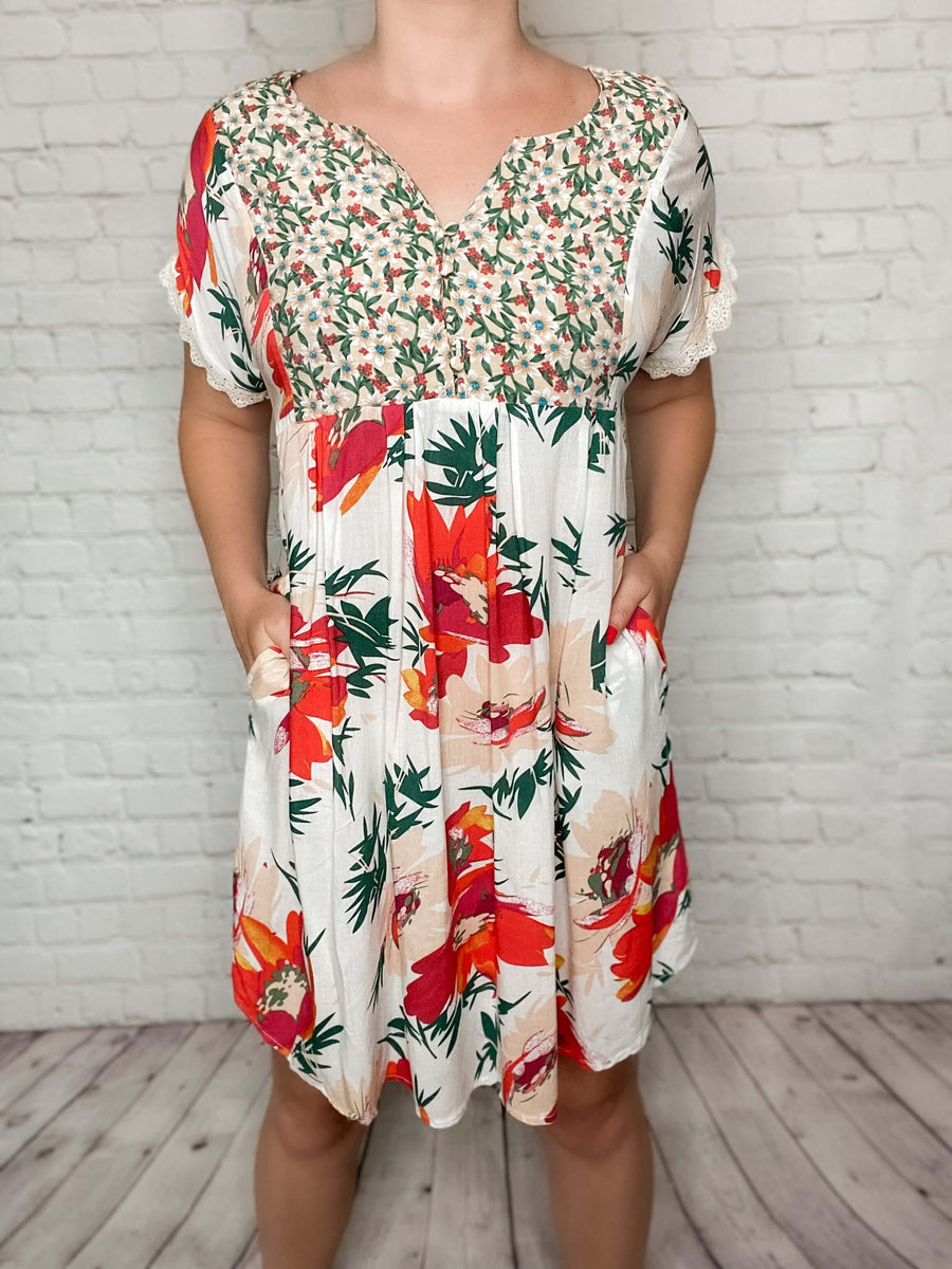 cream dress with red flowers